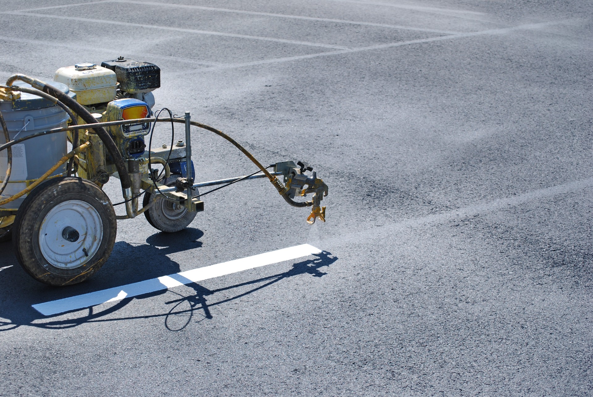 Striping Lines onto fresh asphalt