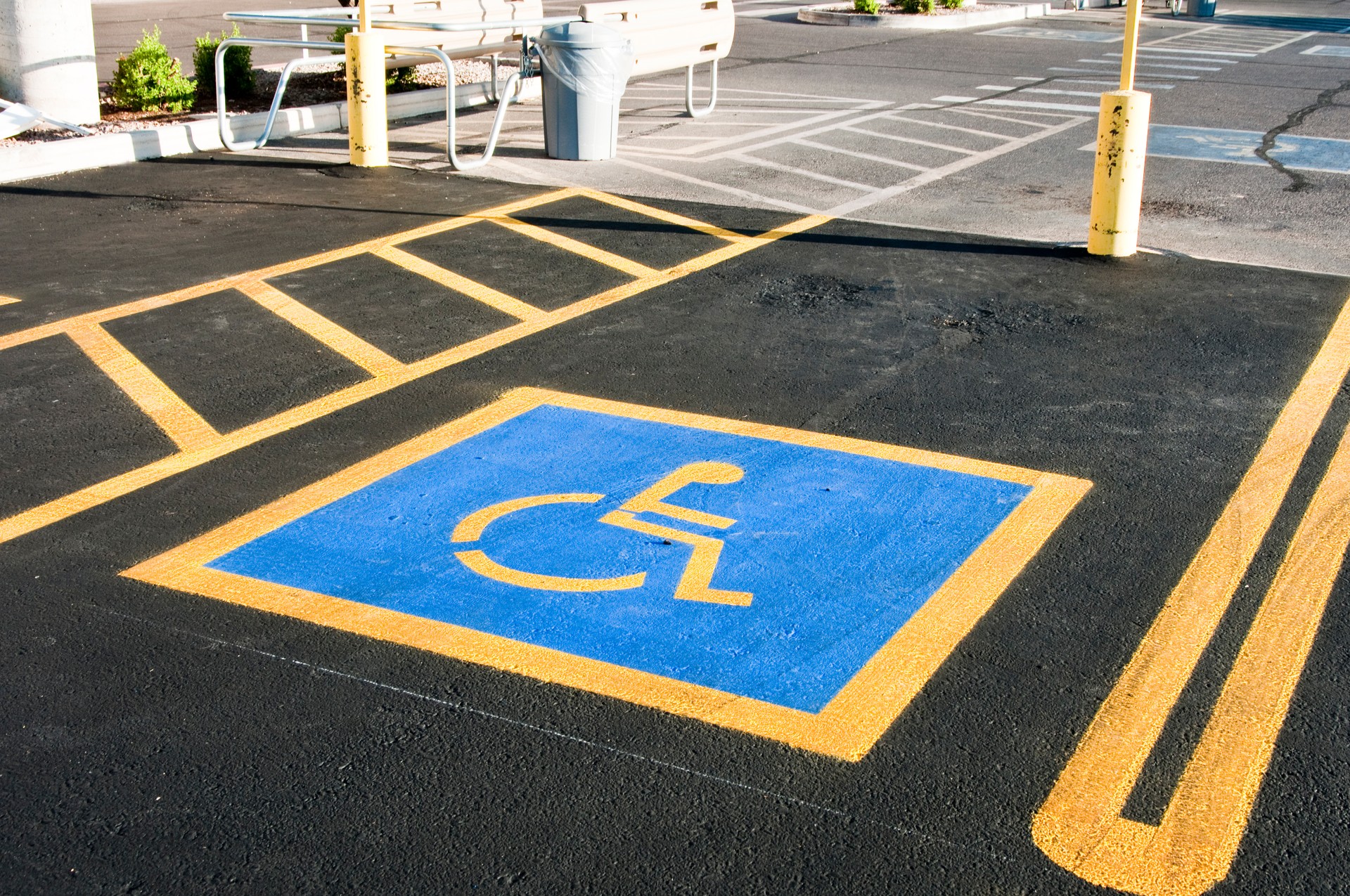 Blue and yellow empty handicap parking space