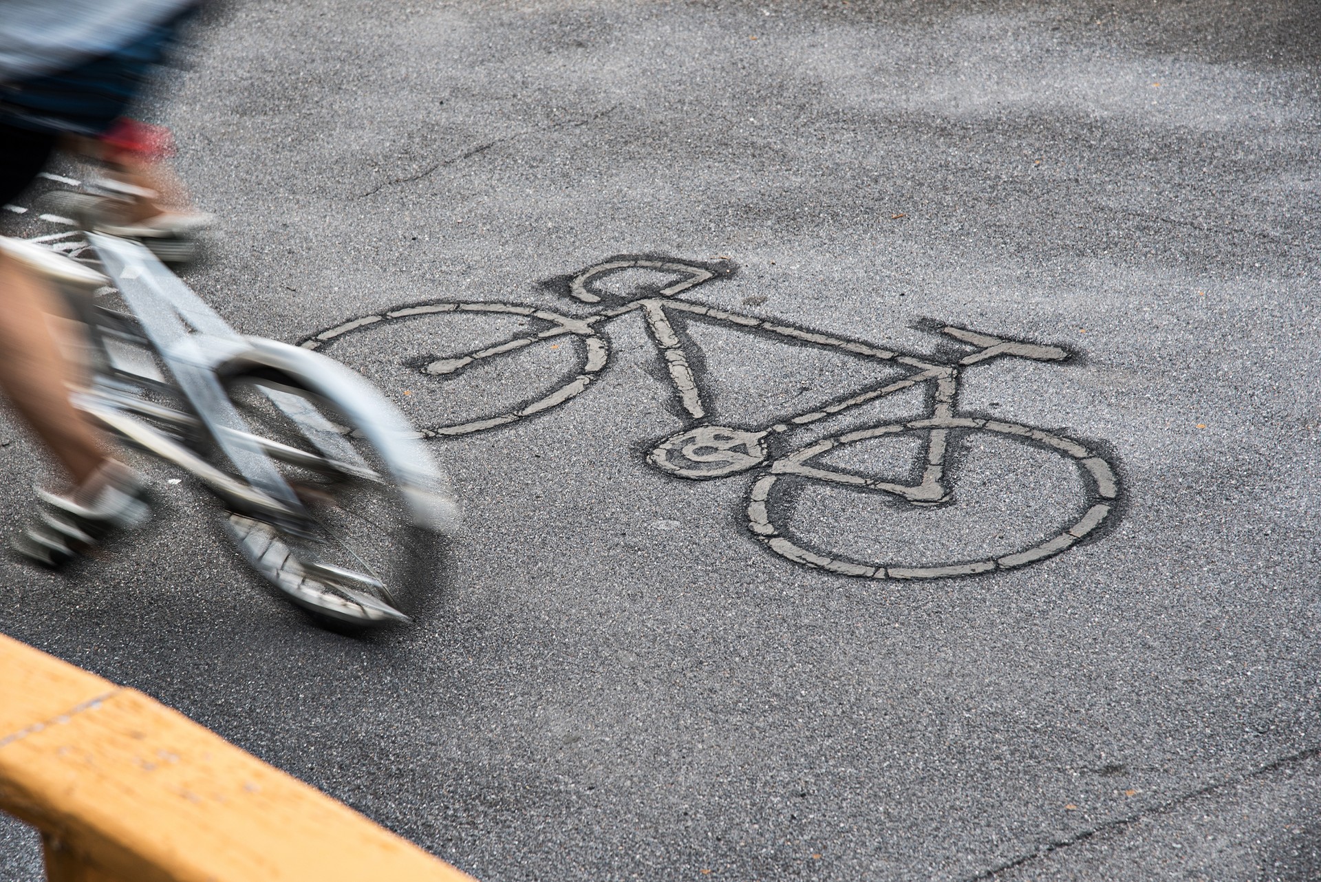 Blurred Motion Of Man Cycling On Street